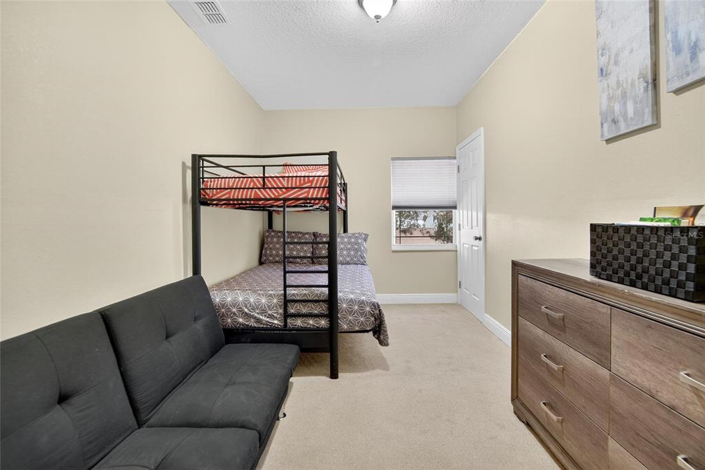 4639 Birdsong Boulevard, Unit 2 Lutz, FL 33559 - Photo 20 of 25 a living room with furniture and a window