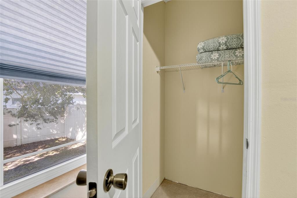 4639 Birdsong Boulevard, Unit 2 Lutz, FL 33559 - Photo 23 of 25 a bathroom with a glass shower door and a window