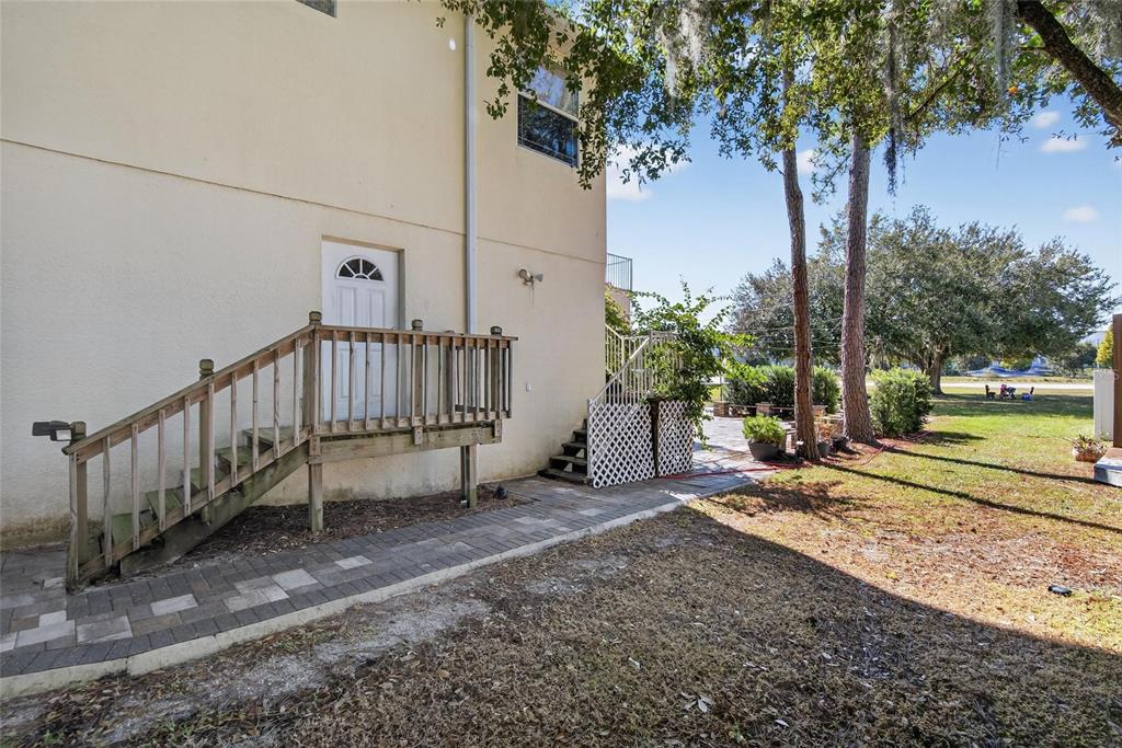 4639 Birdsong Boulevard, Unit 2 Lutz, FL 33559 - Photo 4 of 25 a view of a backyard with a small yard