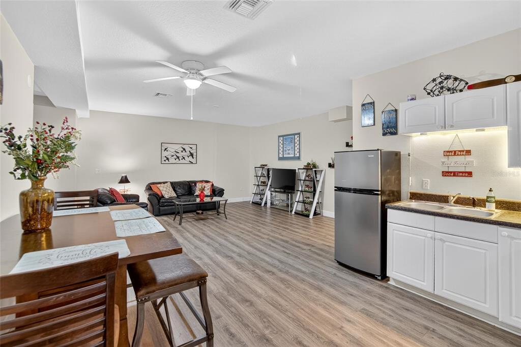 4639 Birdsong Boulevard, Unit 2 Lutz, FL 33559 - Photo 9 of 25 a living room with furniture and kitchen view