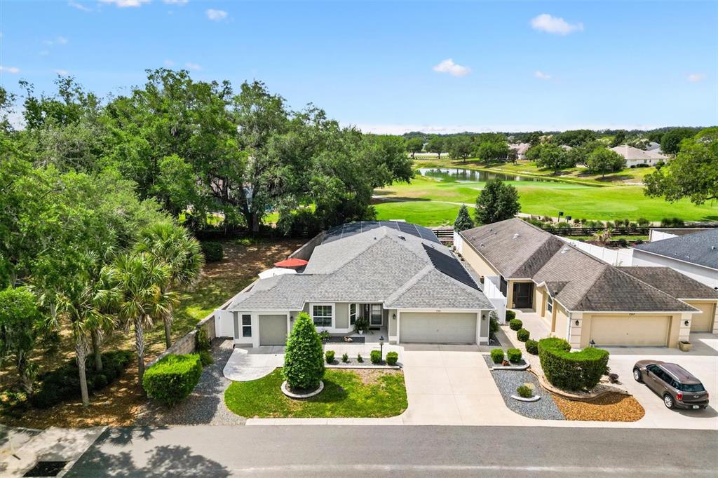 7351 Southeast 169th Cote Loop The Villages, FL 32162 - Photo 4 of 32 an aerial view of a house with garden space and street view