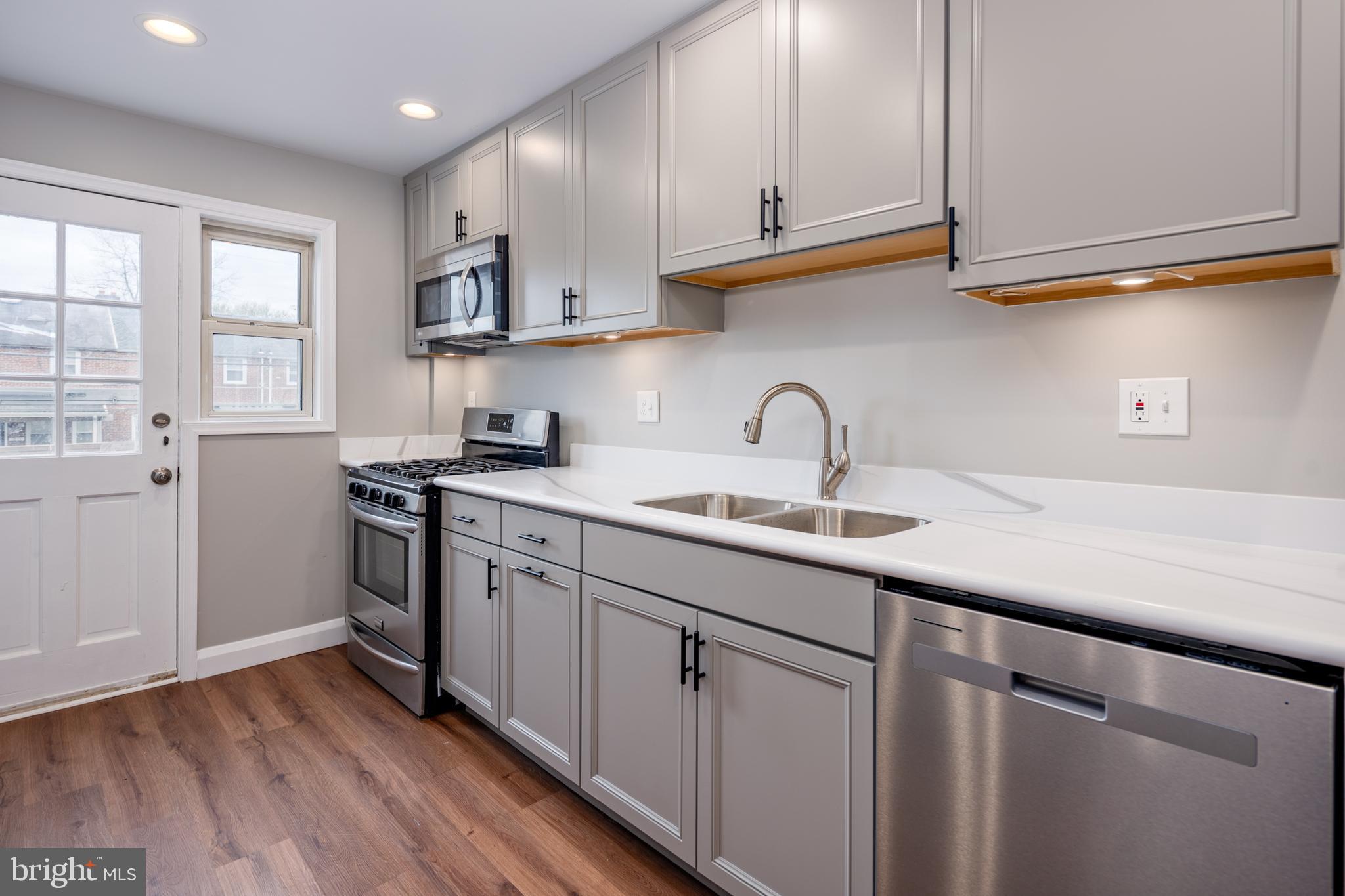 1621 Thetford Road Towson, MD 21286 - Photo 11 of 35 a kitchen with sink cabinets and a window