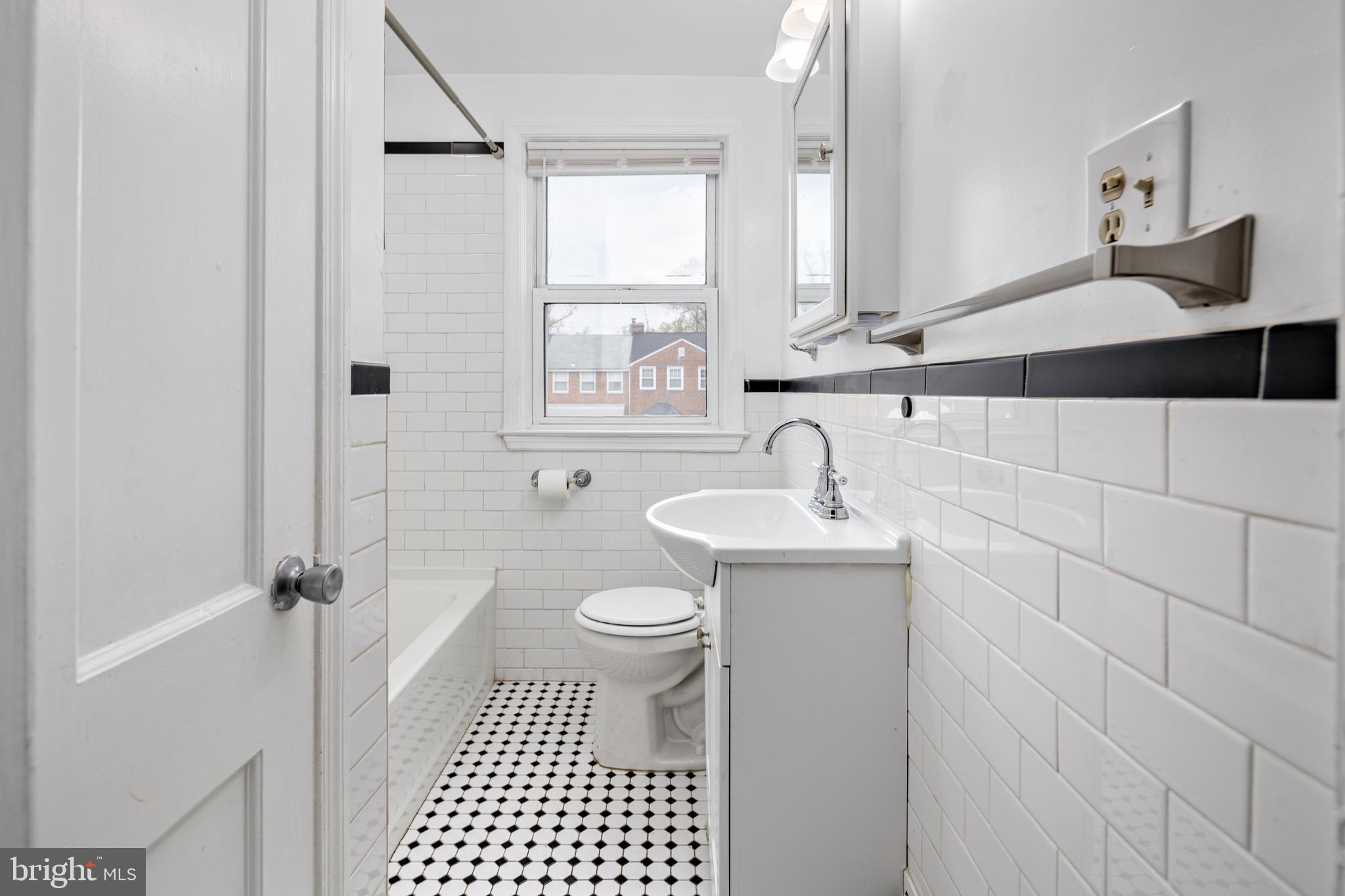 1621 Thetford Road Towson, MD 21286 - Photo 17 of 35 a bathroom with a sink a toilet and shower