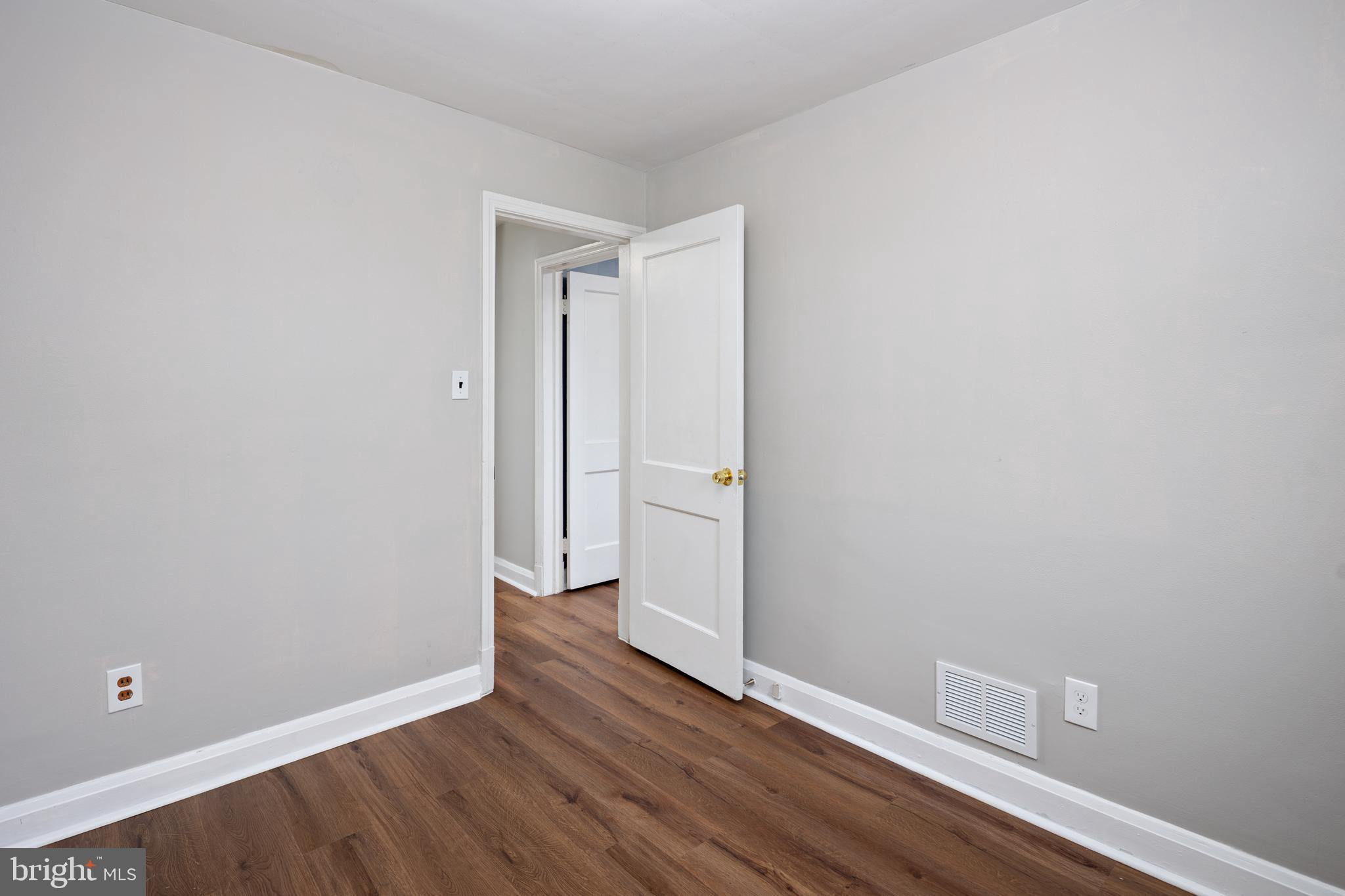 1621 Thetford Road Towson, MD 21286 - Photo 22 of 35 a view of an empty room with wooden floor