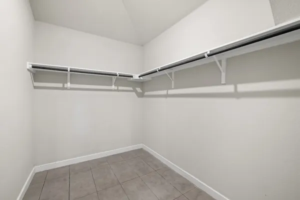 a living room with closet and windows