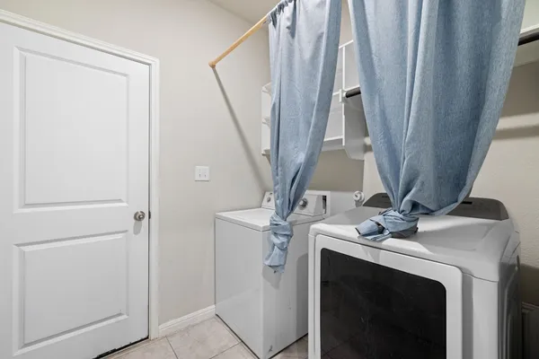 a view of an empty room with a flat screen tv