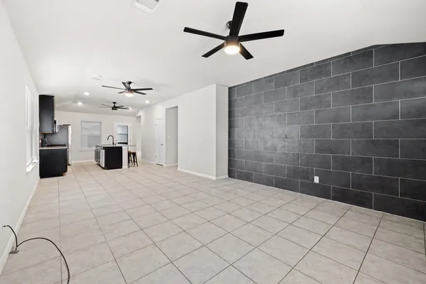 a view of an empty room and a window