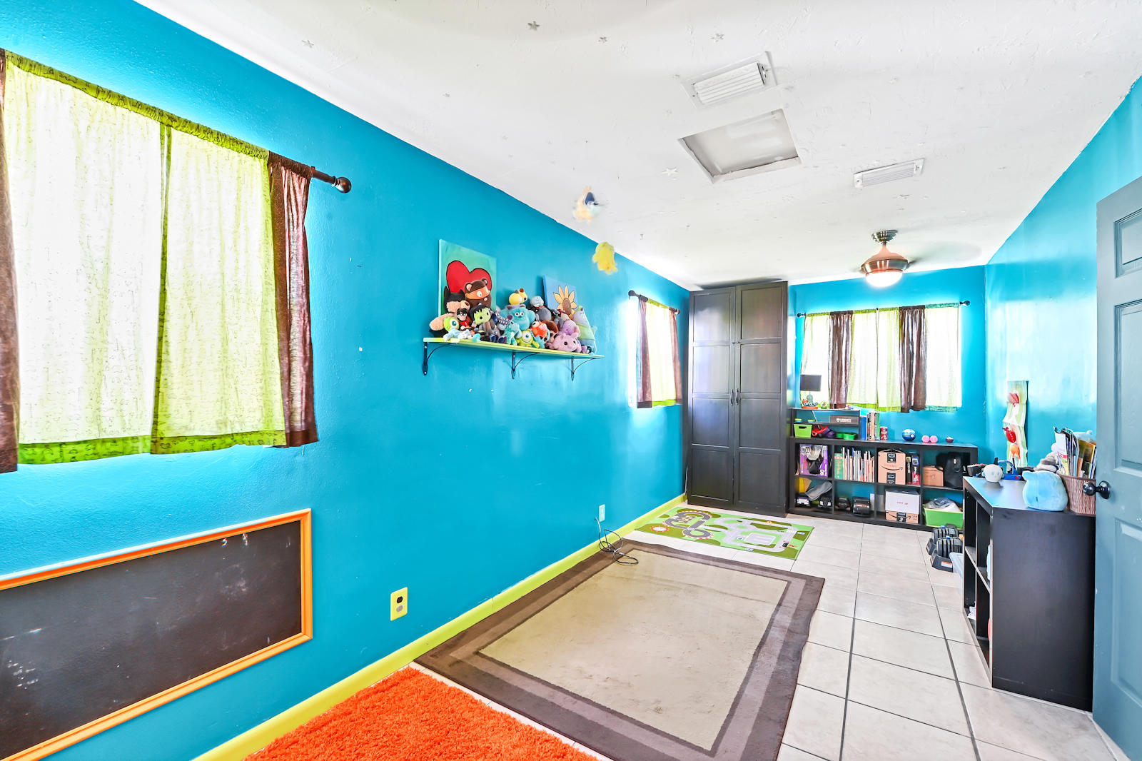 344 Winged Foot Road Palm Springs, FL 33461 - Photo 14 of 20 a room with furniture and window