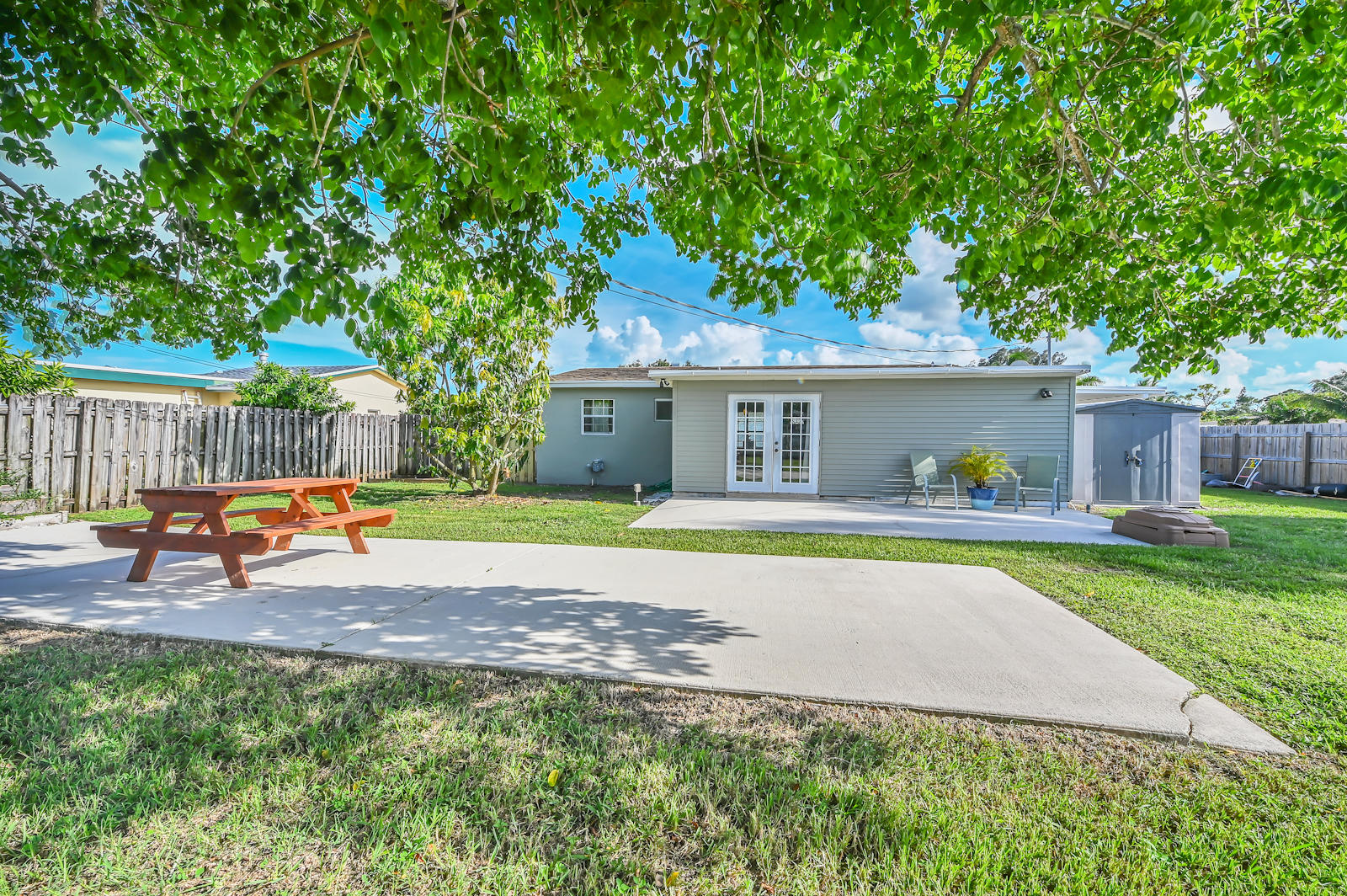 344 Winged Foot Road Palm Springs, FL 33461 - Photo 20 of 20 a swimming pool with outdoor seating and yard