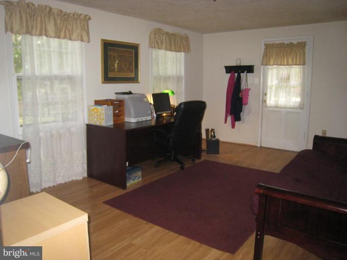 8263 Toll House Road Annandale, VA 22003 - Photo 2 of 24 a view of a workspace with furniture and a window