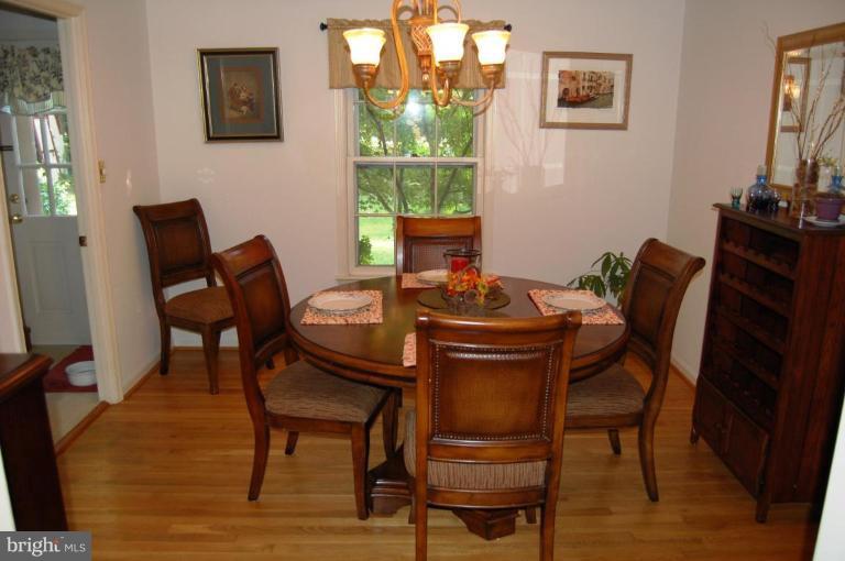 8263 Toll House Road Annandale, VA 22003 - Photo 11 of 24 a view of a dining room with furniture and a window