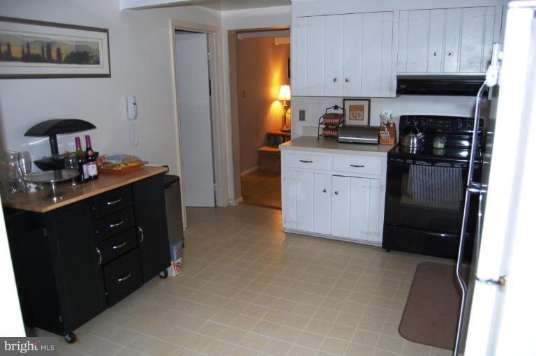 8263 Toll House Road Annandale, VA 22003 - Photo 14 of 24 a kitchen with stainless steel appliances granite countertop a refrigerator and a stove top oven
