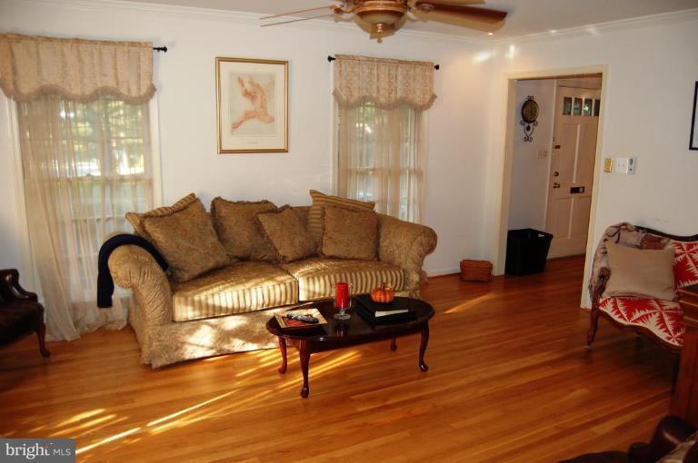 8263 Toll House Road Annandale, VA 22003 - Photo 18 of 24 a living room with furniture and a wooden floor