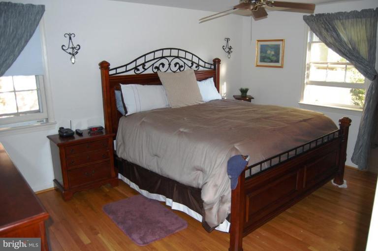 8263 Toll House Road Annandale, VA 22003 - Photo 19 of 24 a bed sitting in a bedroom next to a window
