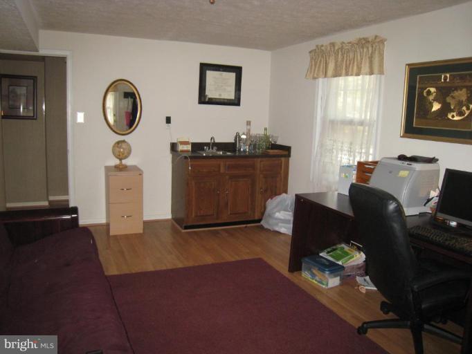 8263 Toll House Road Annandale, VA 22003 - Photo 3 of 24 a living room with furniture and a window