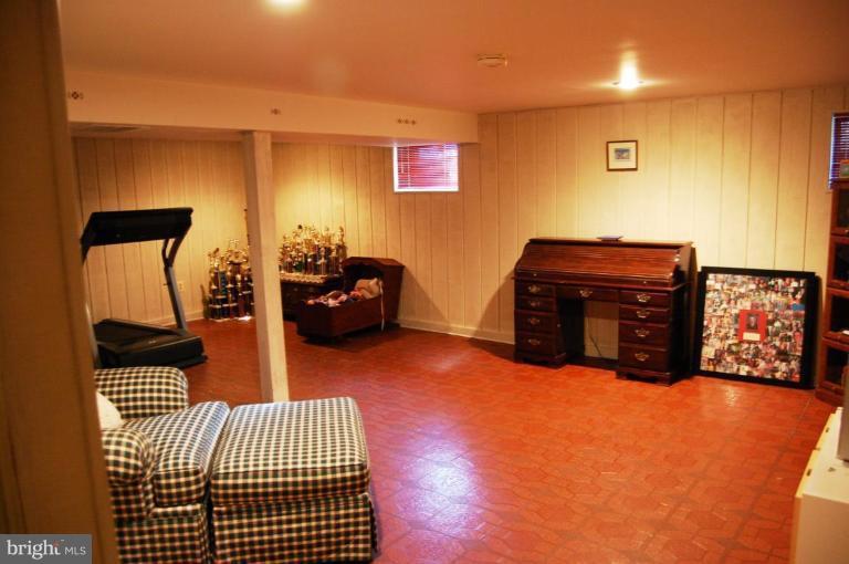 8263 Toll House Road Annandale, VA 22003 - Photo 21 of 24 a bedroom with furniture and a wooden floor