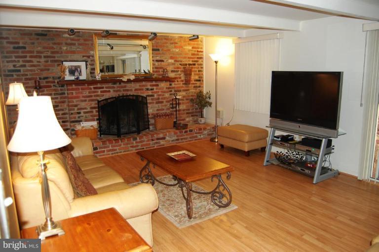 8263 Toll House Road Annandale, VA 22003 - Photo 24 of 24 a living room with furniture and a flat screen tv