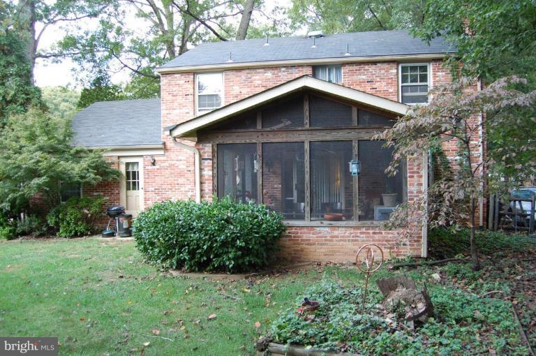 8263 Toll House Road Annandale, VA 22003 - Photo 4 of 24 a front view of a house with yard and green space