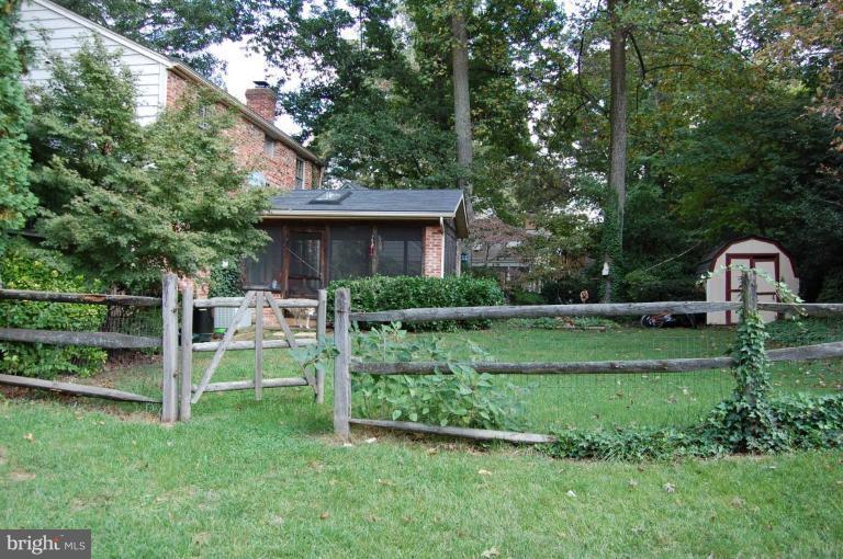 8263 Toll House Road Annandale, VA 22003 - Photo 6 of 24 a view of backyard with chair and garden