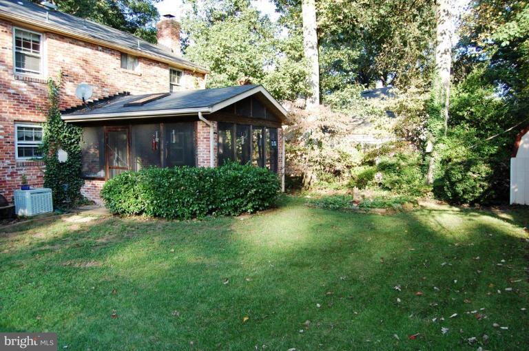 8263 Toll House Road Annandale, VA 22003 - Photo 7 of 24 a view of a backyard with plants and a large tree
