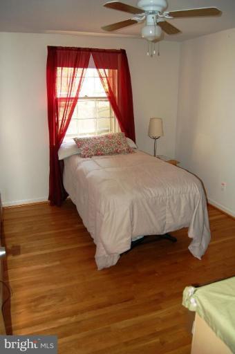 8263 Toll House Road Annandale, VA 22003 - Photo 8 of 24 a bedroom with a bed and a window