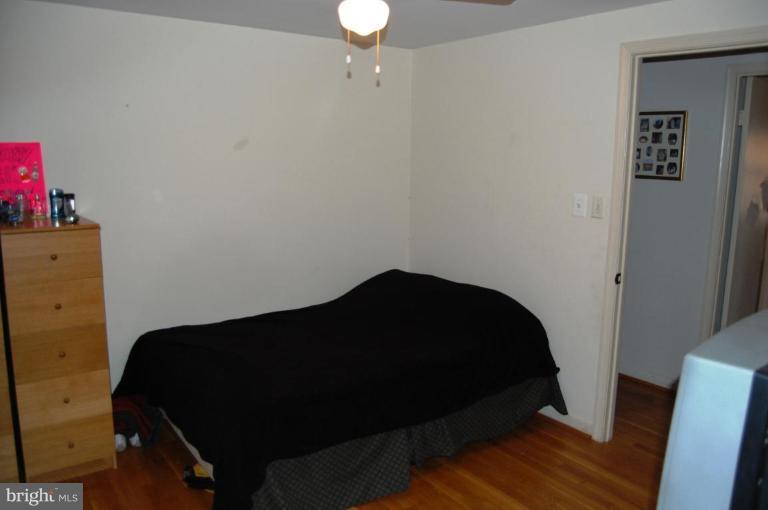 8263 Toll House Road Annandale, VA 22003 - Photo 9 of 24 a bedroom with a bed and a dresser