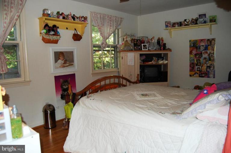 8263 Toll House Road Annandale, VA 22003 - Photo 10 of 24 a bedroom with a bed and a window