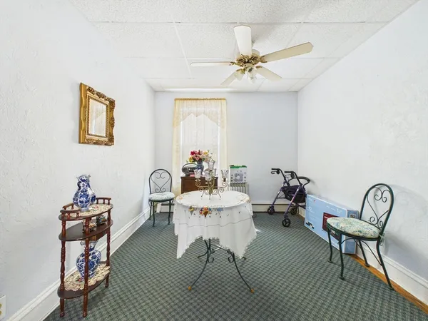 a dining room with furniture and window