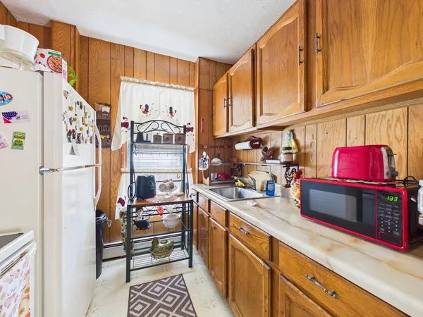 a kitchen with stainless steel appliances a stove and a refrigerator