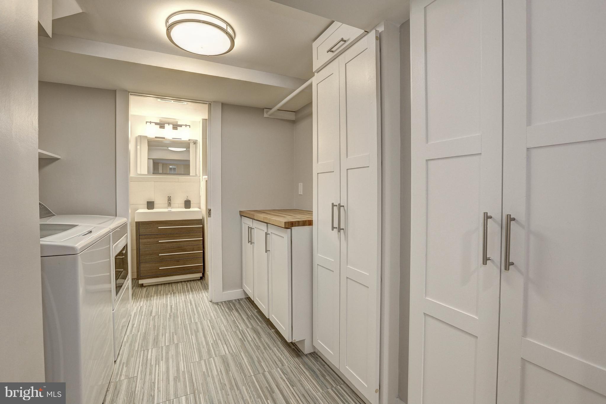 5911 Cobalt Road Bethesda, MD 20816 - Photo 21 of 27 Fabulous laundry area with wood folding surface