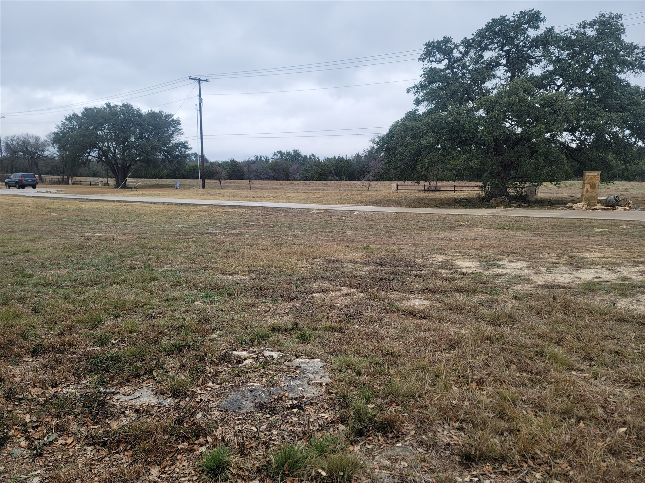 104 Gabgrove Court Georgetown, TX 78633 - Photo 4 of 11 Expansive undeveloped lot with mature trees and a paved path
