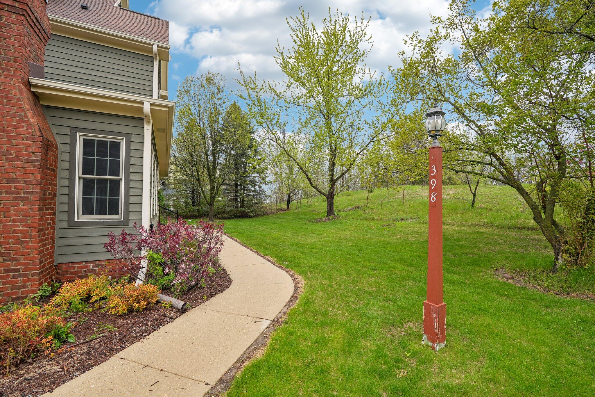 398 Oneida Street Delafield, WI 53018 - Photo 4 of 53 Walkway to private entrance
