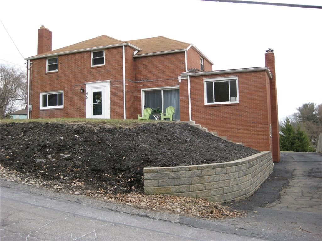 438 Woodland Road Pittsburgh, PA 15237 - Photo 1 of 25 Ext Front you can see a newer stone wall and landscaping and a driveway for 12 cars