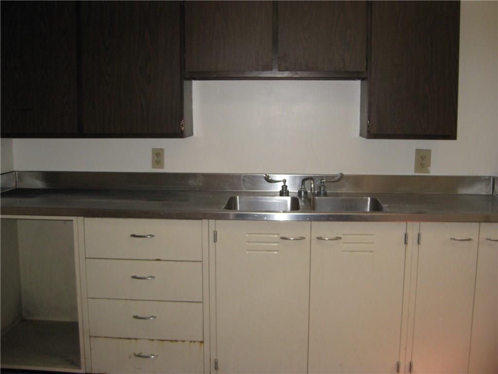 438 Woodland Road Pittsburgh, PA 15237 - Photo 22 of 25 Lower level laundryroom,with freezer,cabinetry,and walk out door to yard