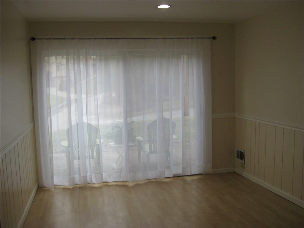 438 Woodland Road Pittsburgh, PA 15237 - Photo 9 of 25 1st floor den with sliding glass door and powderroom and walk in closet and chalkboard