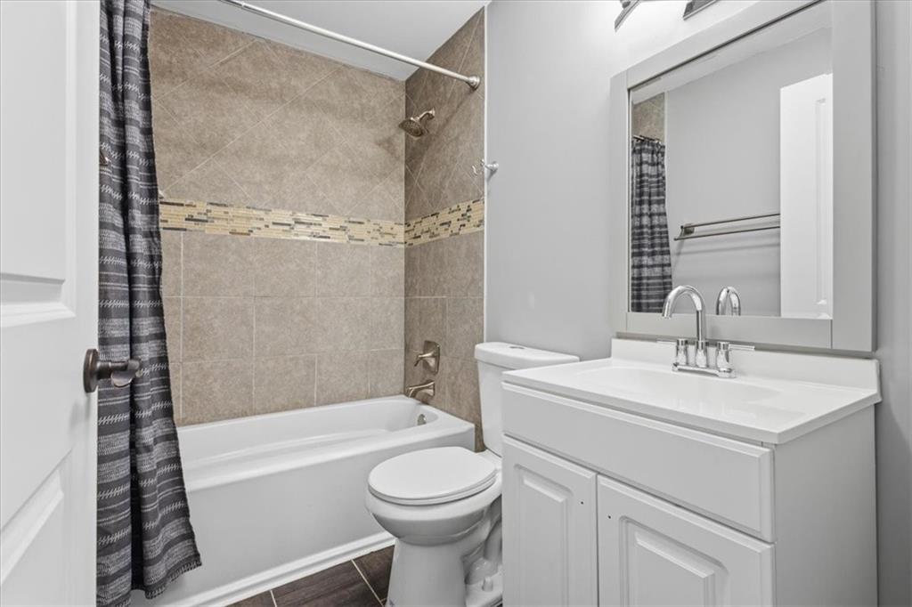 409 Calhoun Avenue Northeast Rome, GA 30161 - Photo 22 of 25 a bathroom with a sink toilet and shower