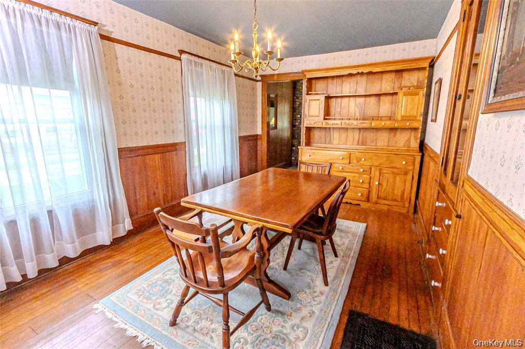 630 New Suffolk Road Cutchogue, NY 11935 - Photo 13 of 33 a dining room with furniture and window