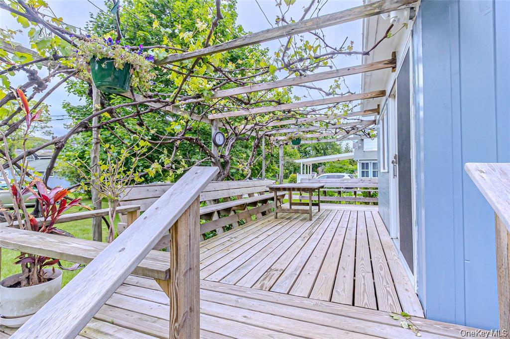 630 New Suffolk Road Cutchogue, NY 11935 - Photo 16 of 33 a view of balcony with wooden floor and outdoor space