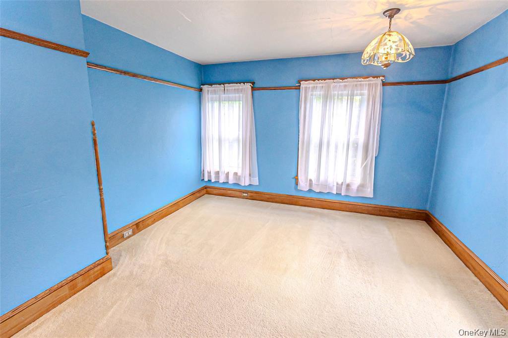 630 New Suffolk Road Cutchogue, NY 11935 - Photo 19 of 33 a view of an empty room with a window