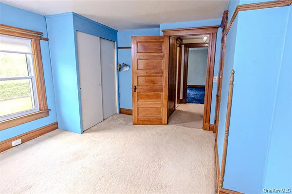 a bedroom with a bed and a table in it