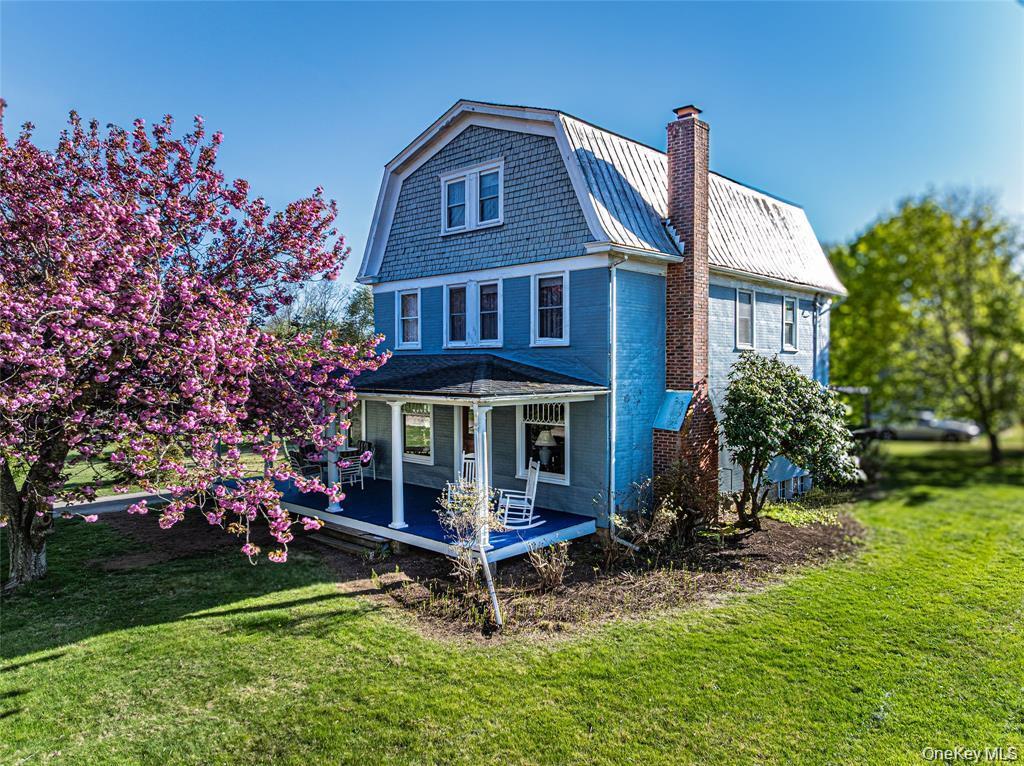 630 New Suffolk Road Cutchogue, NY 11935 - Photo 2 of 33 a view of house with a yard