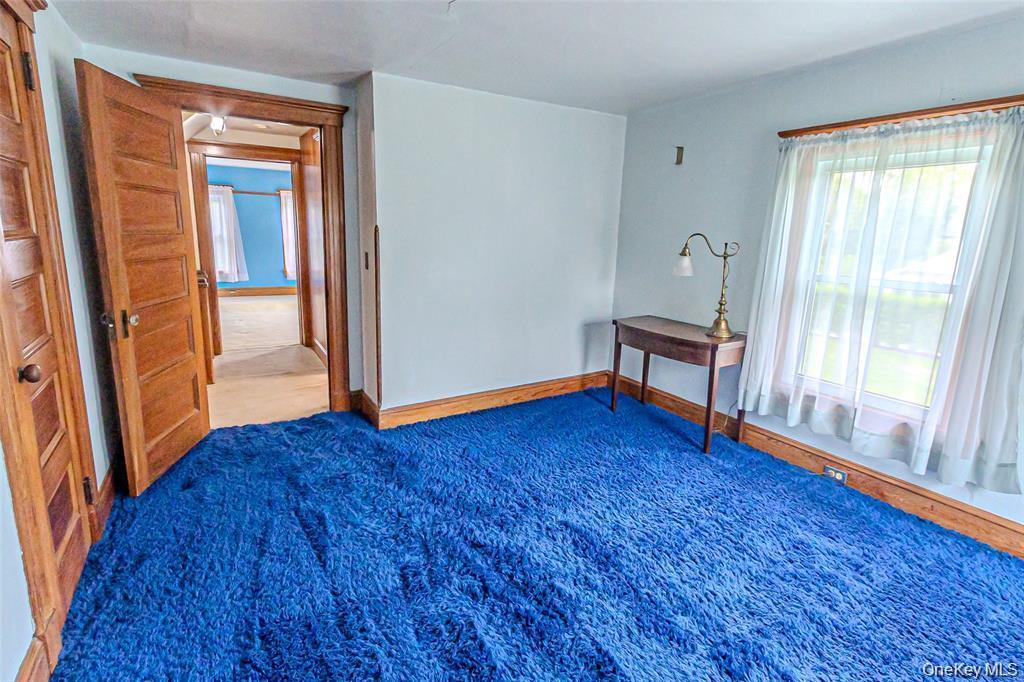630 New Suffolk Road Cutchogue, NY 11935 - Photo 22 of 33 a view of empty room with wooden floor and fan