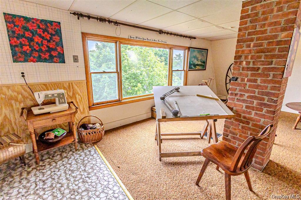 630 New Suffolk Road Cutchogue, NY 11935 - Photo 29 of 33 a bedroom with furniture and a window