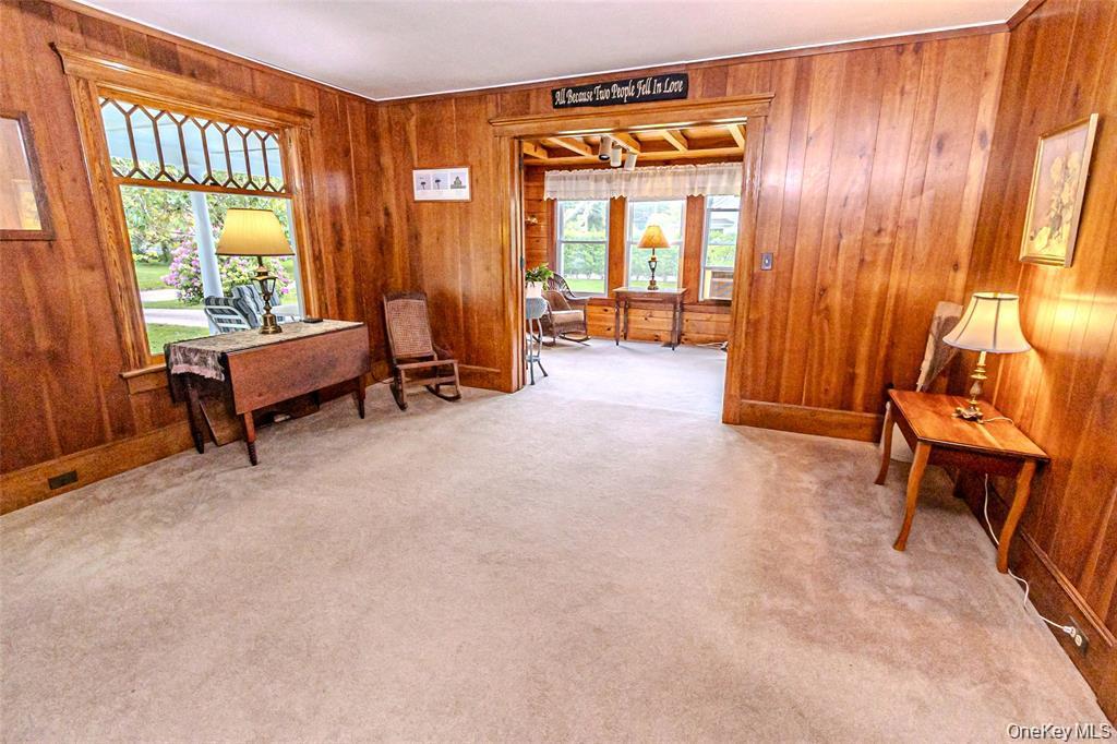 630 New Suffolk Road Cutchogue, NY 11935 - Photo 10 of 33 a living room with furniture and a window