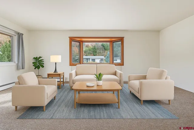 a living room with furniture and a large window