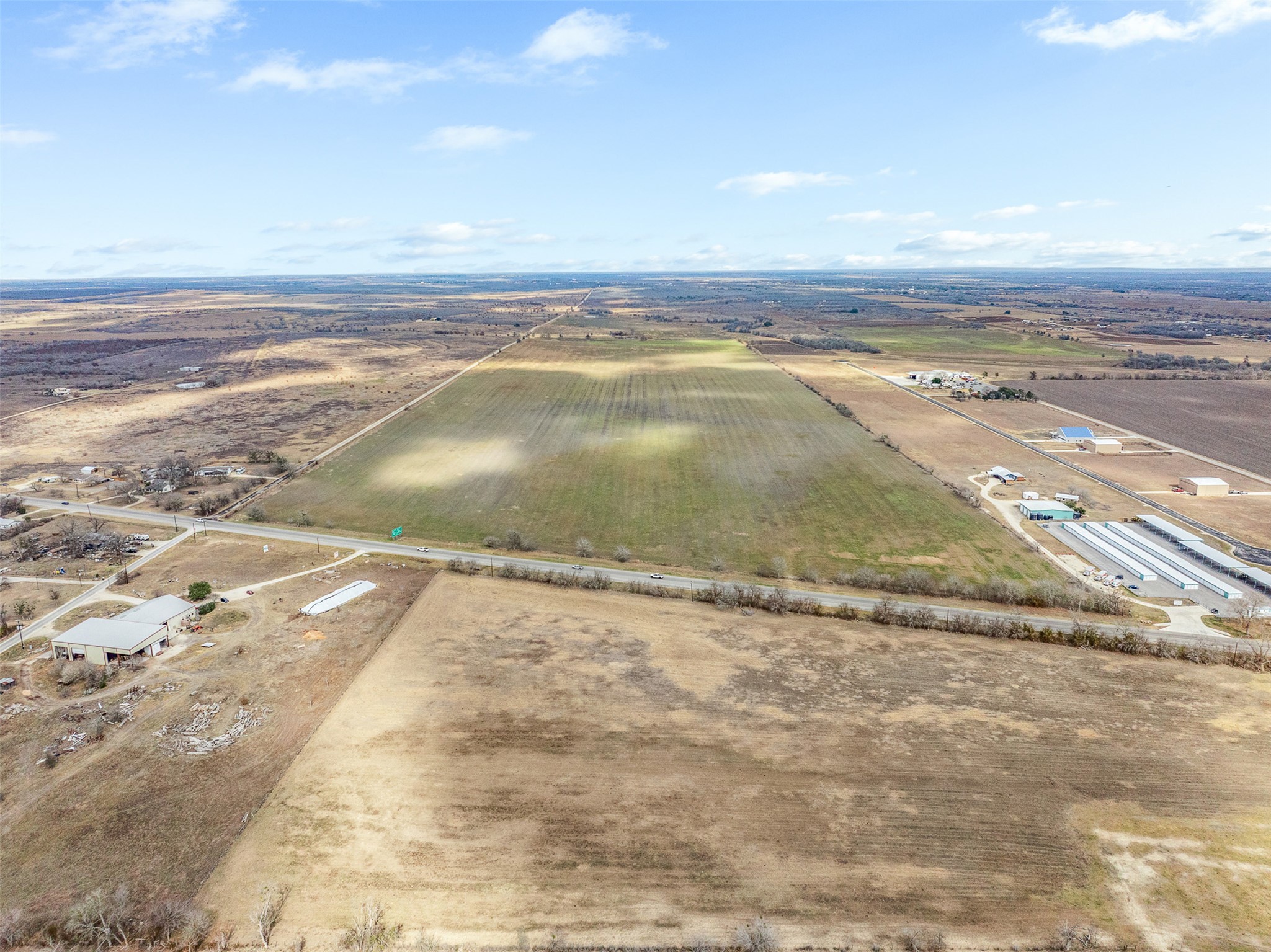 2884 Political Road Lockhart, TX 78644 - Photo 29 of 38 Aerial view of sparsely populated area featuring rows of crops