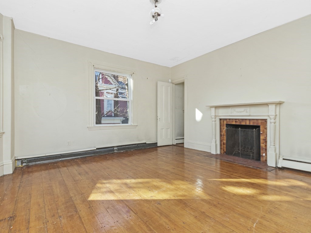 90 Addington Road, Unit 2 Brookline, MA 02445 - Photo 12 of 41 an empty room with windows