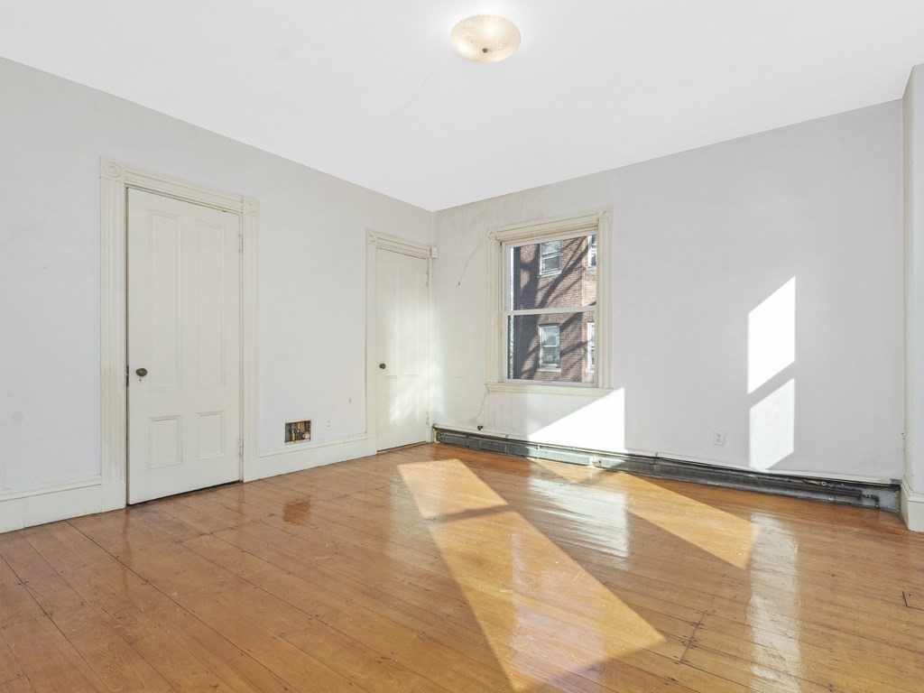 90 Addington Road, Unit 2 Brookline, MA 02445 - Photo 14 of 41 a view of an empty room and window