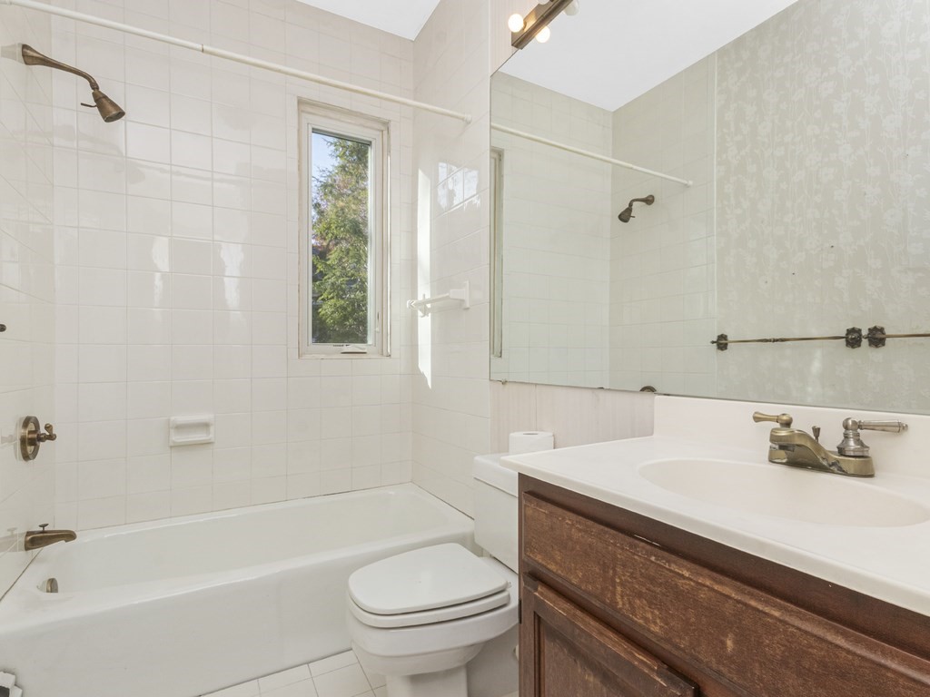 90 Addington Road, Unit 2 Brookline, MA 02445 - Photo 18 of 41 a bathroom with a sink a toilet and shower
