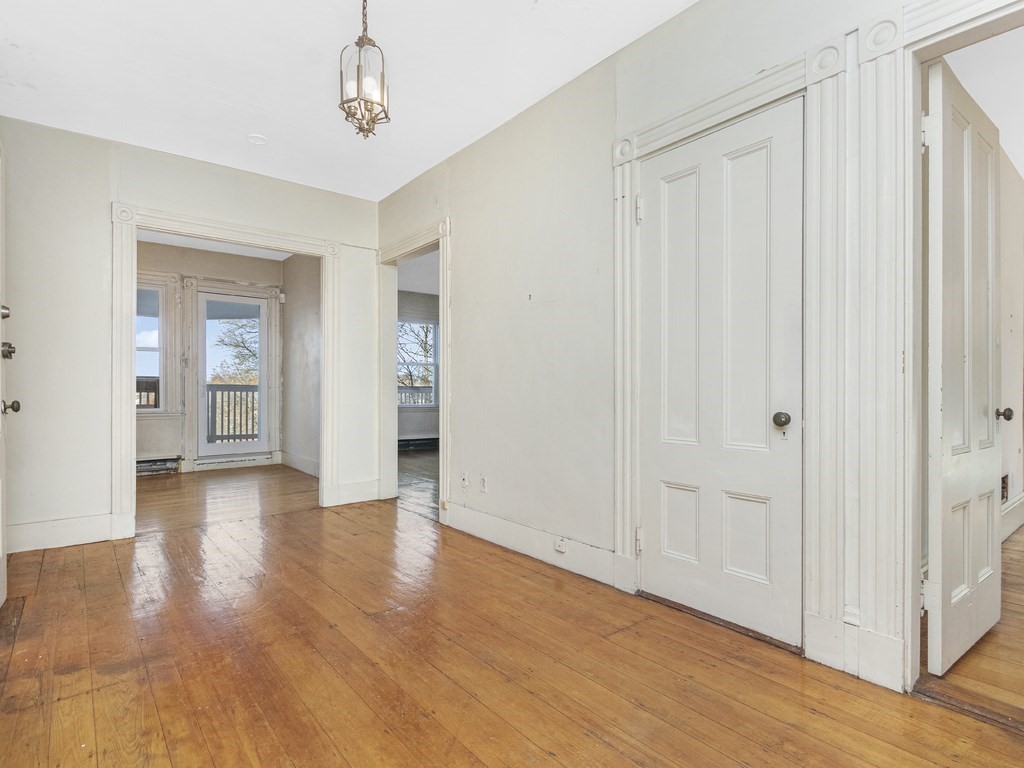 90 Addington Road, Unit 2 Brookline, MA 02445 - Photo 19 of 41 a view of a hallway with wooden floor